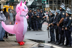 NEW YORK, NY, USA – JUNE 14, 2025 – A person dressed as an axolotl attends a protest at Federal Plaza in Lower Manhattan, along with other demonstrators taunts members of the New York City Police Department. They were protesting the detention of individuals who had been rounded up in ICE immigration arrests.