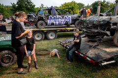 AUGUSTA, NJ USA - AUGUST 4, 2025 - A mother has little patience for her protesting daughter while in the pit area before the second night of the 2025 Demolition Derby during the NJ State Fair held at the Sussex County Fairgrounds.