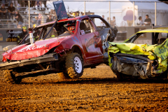 AUGUSTA, NJ USA - AUGUST 3, 2025 - Driver Kenneth Lambert is knocked up on two wheels after colliding with another car. The first night of the 2025 Demolition Derby during the NJ State Fair held at the Sussex County Fairgrounds.