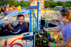 AUGUSTA, NJ, USA - AUGUST 3, 2025 -  In the pit area, Izabelle Babcock runs to congratulate her father, Doug, for winning his heat. The first night of the 2025 Demolition Derby during the NJ State Fair held at the Sussex County Fairgrounds.
