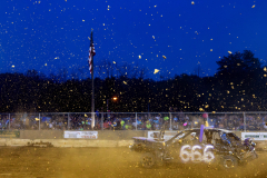 AUGUSTA, NJ, USA - AUGUST 4, 2025 - Dirt flies as Matt Larese, of Vernon, NJ, speeds through the arena during a heat. The second night of the 2025 Demolition Derby during the NJ State Fair held at the Sussex County Fairgrounds