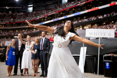 GLENDALE, AZ USA - SEPTEMBER 21, 2025 -  Lindy-Ann Hopley, of Laguna Beach, CA, dances during the memorial. The Charlie Kirk Memorial at State Farm Stadium.